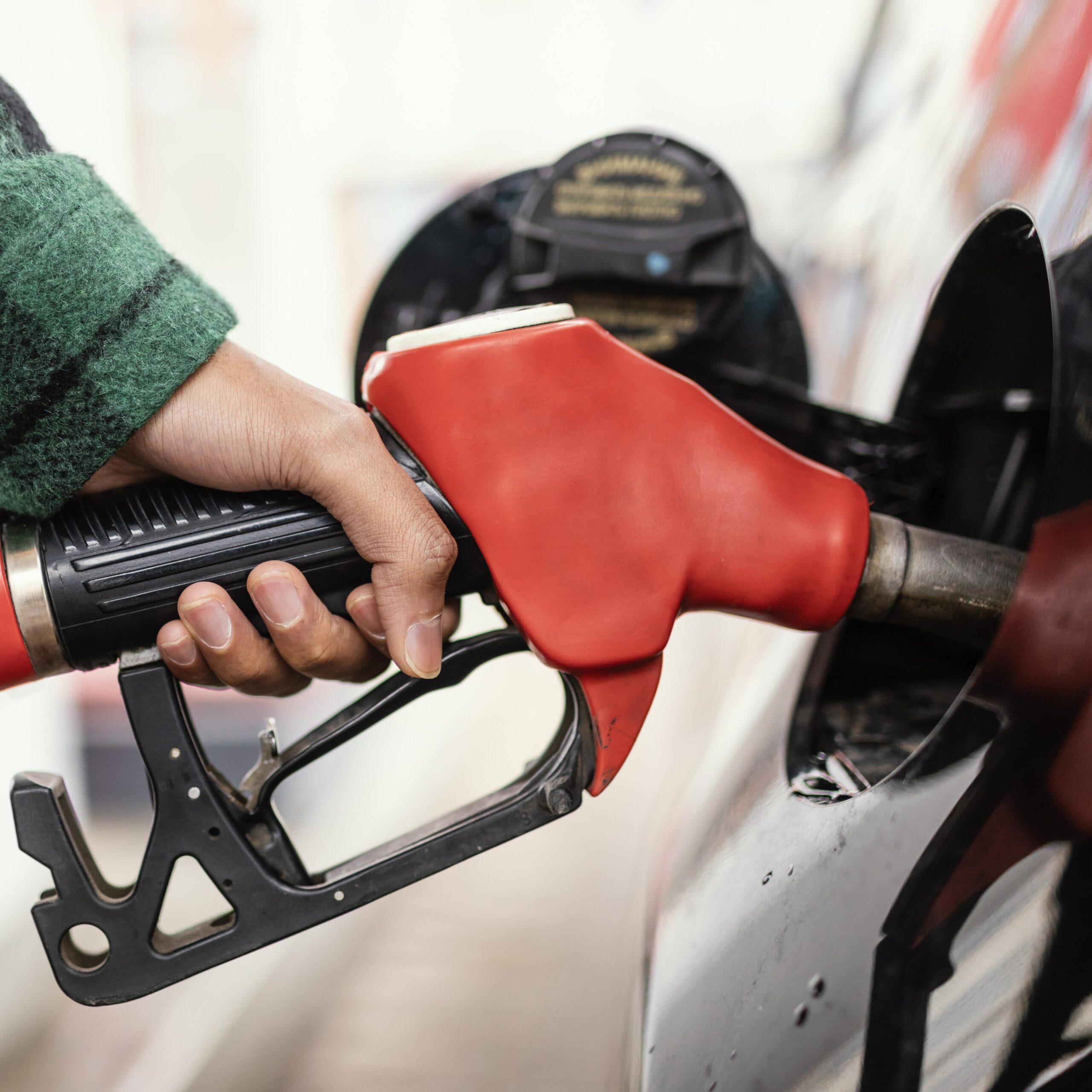 man gas station with car close up